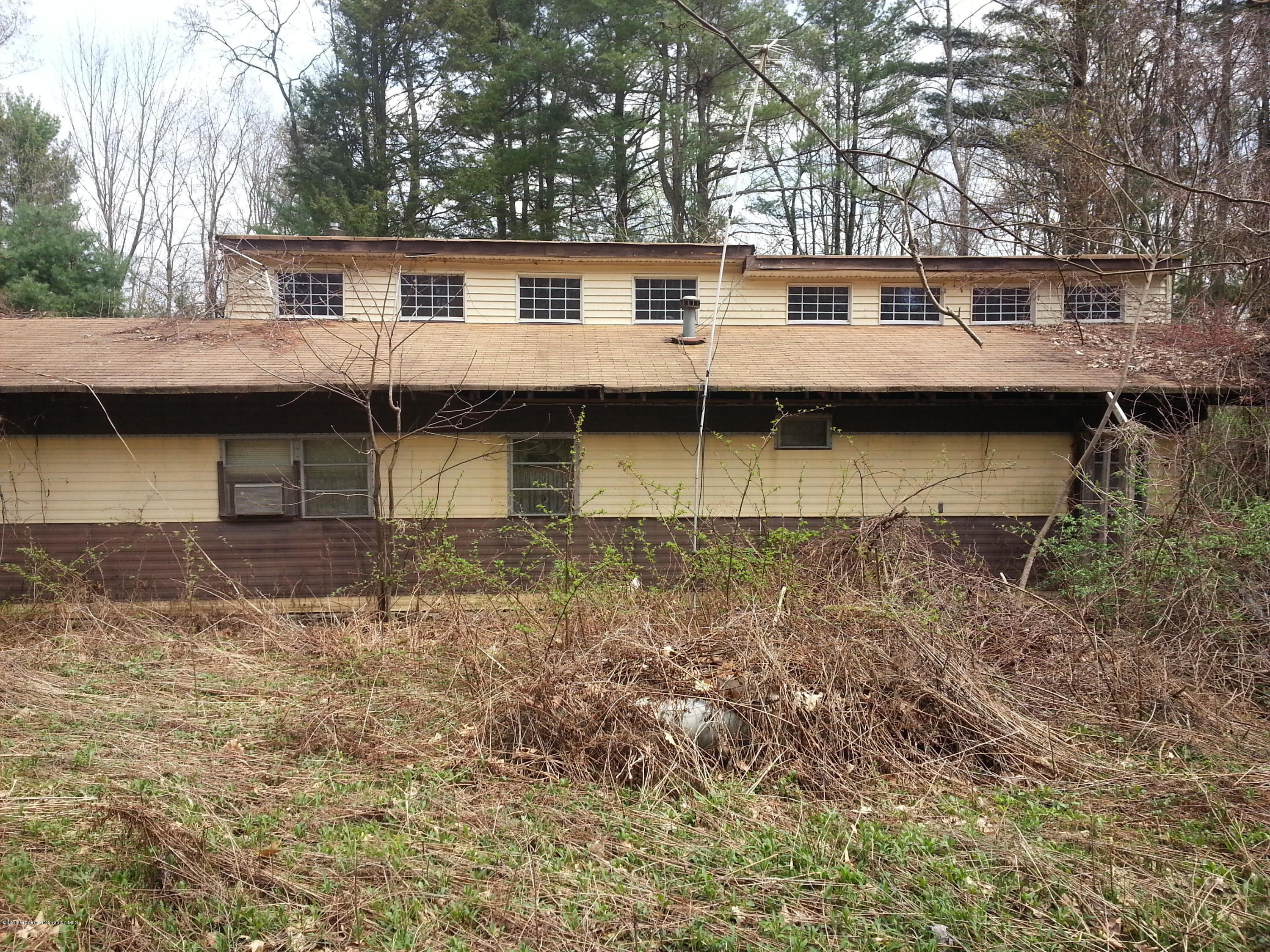 9 Cove Road Tunkhannock, PA 18657 - Photo 1 of 10 a view of a house with a yard