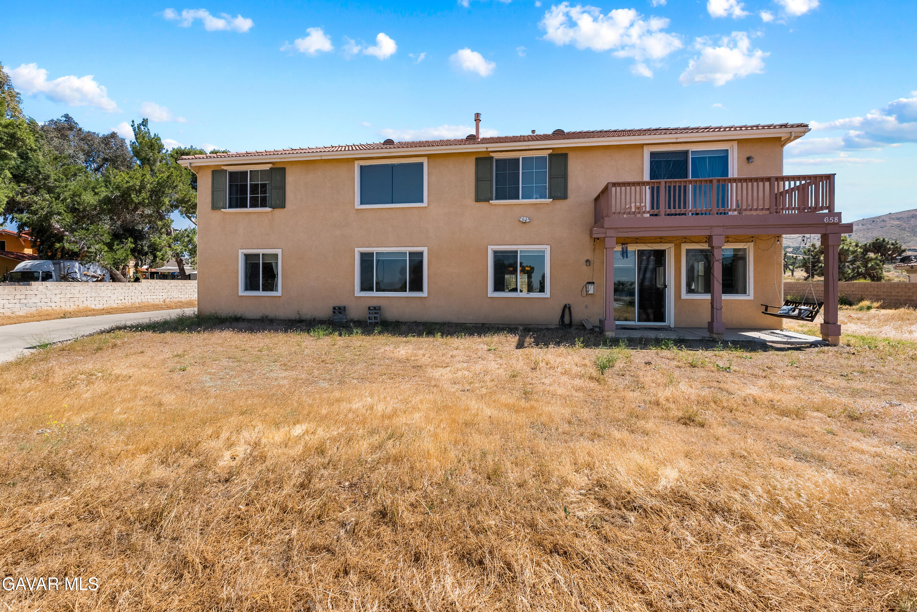658 Lago Lindo Road Palmdale, CA 93550 - Photo 74 of 91 a front view of a house with a yard