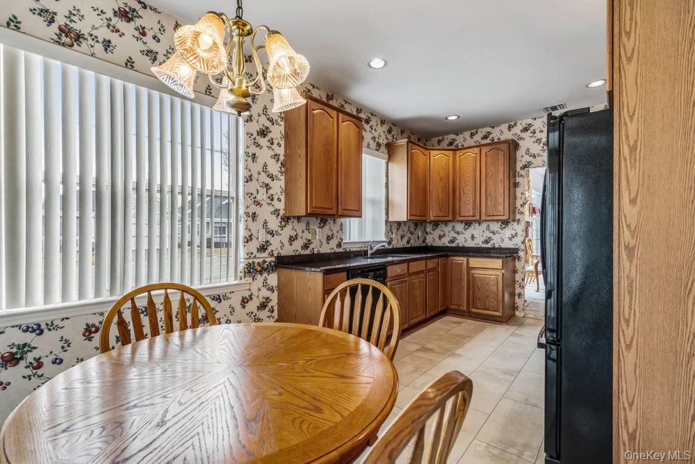 587 Leisure Drive Ridge, NY 11961 - Photo 30 of 49 a spacious bathroom with a granite countertop sink a mirror a bathtub and a shower