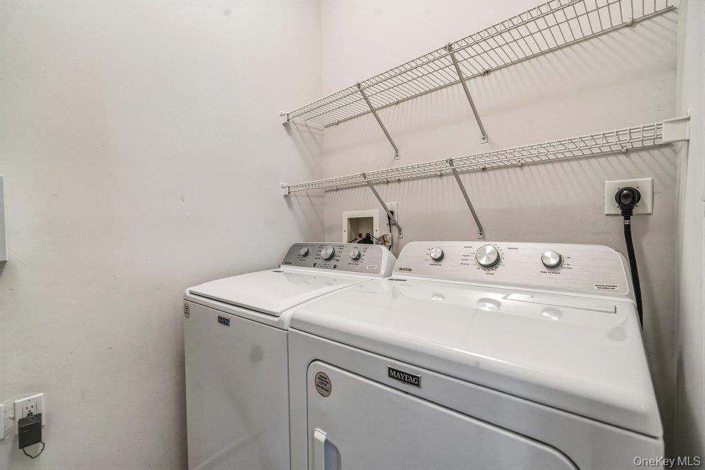 587 Leisure Drive Ridge, NY 11961 - Photo 33 of 49 a utility room with dryer and washer