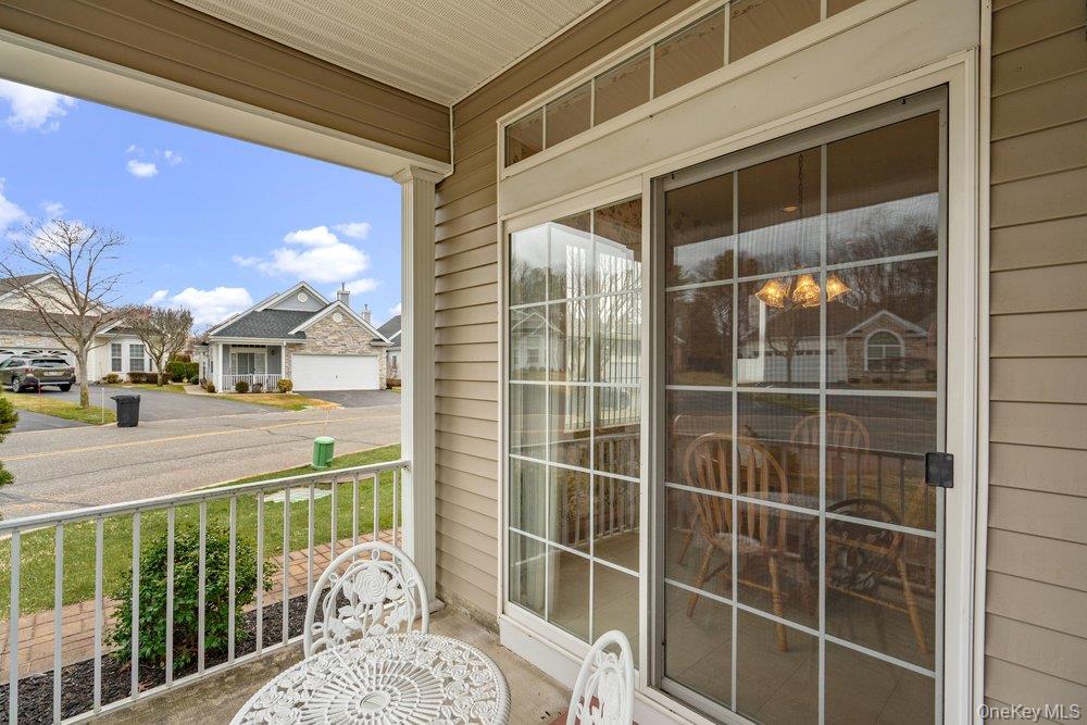 587 Leisure Drive Ridge, NY 11961 - Photo 37 of 49 a view of a balcony with a potted plant