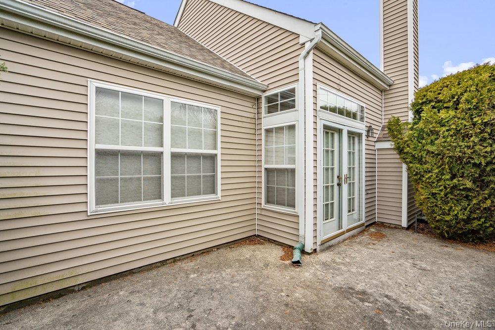 587 Leisure Drive Ridge, NY 11961 - Photo 38 of 49 a view of a house with a yard and garage