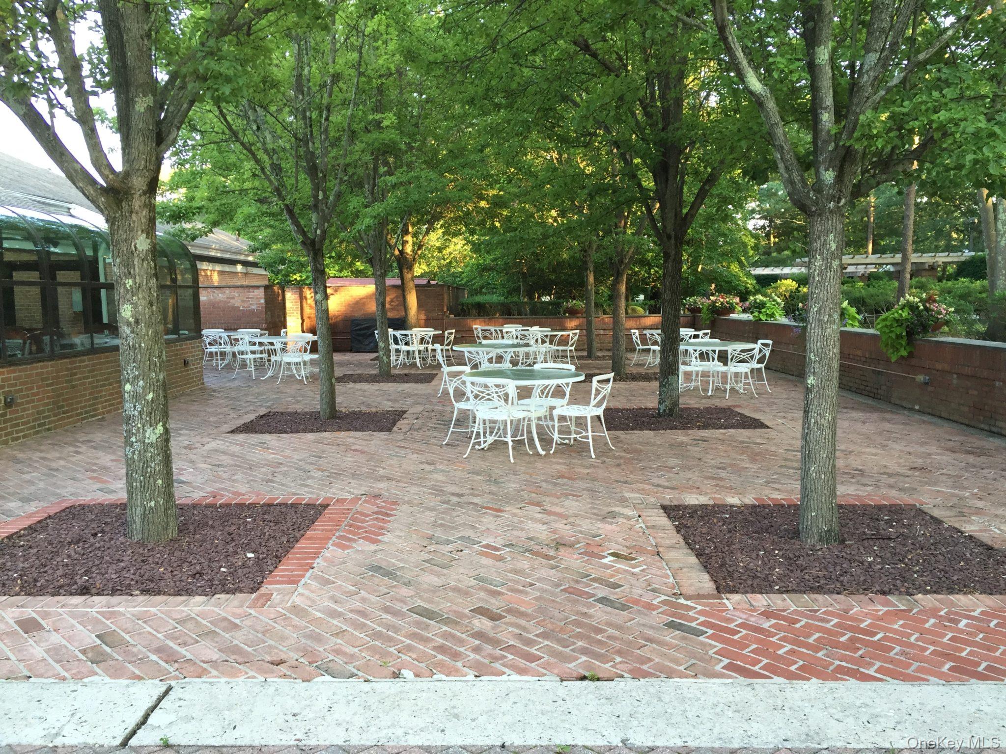 587 Leisure Drive Ridge, NY 11961 - Photo 45 of 49 a view of a backyard with sitting area