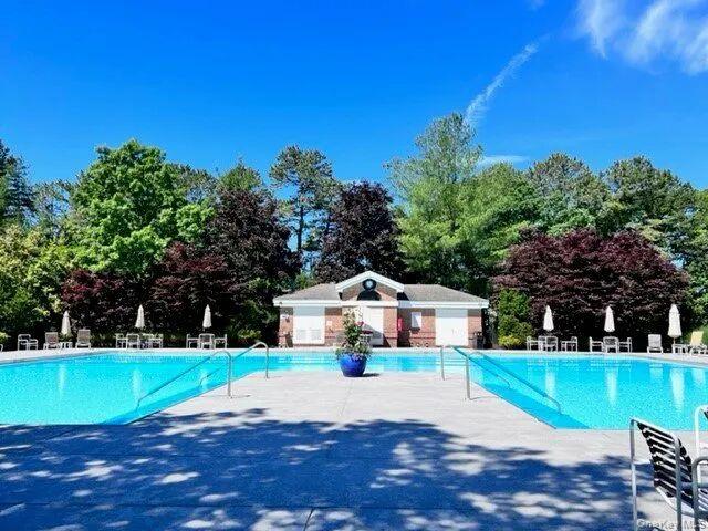 587 Leisure Drive Ridge, NY 11961 - Photo 49 of 49 a view of house with outdoor space and swimming pool