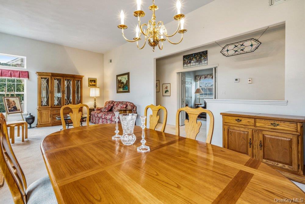 587 Leisure Drive Ridge, NY 11961 - Photo 8 of 49 a view of a dining room with furniture