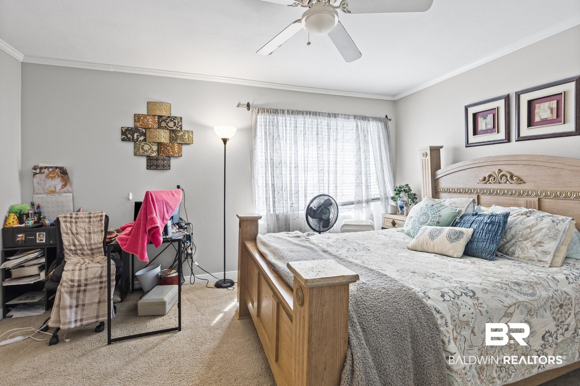 114 Du Rhu Drive, Unit A Mobile, AL 36608 - Photo 10 of 14 Bedroom featuring ornamental molding, light carpet, and a ceiling fan