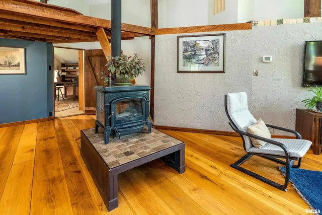 a view of a dining room with furniture and a rug