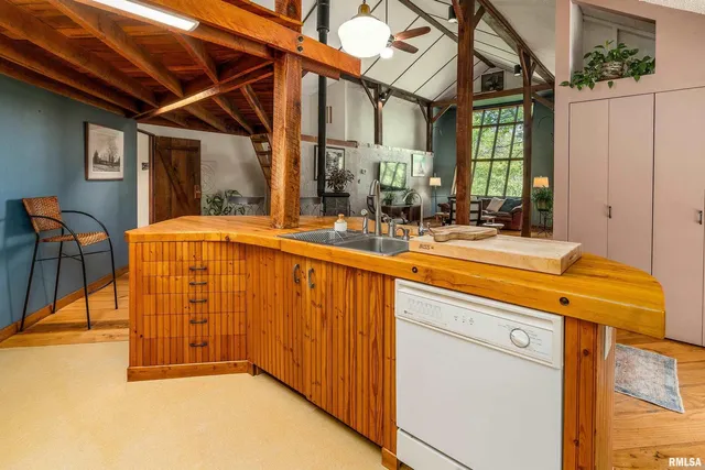 a view of a kitchen with furniture and a kitchen view