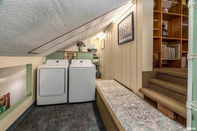 a bedroom with a bed and a tv