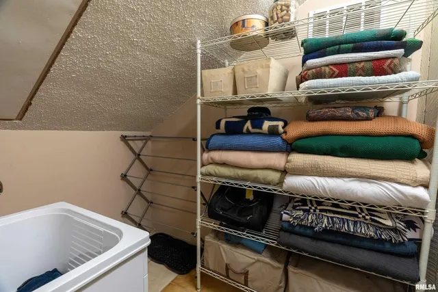 a bedroom with a bed and furniture