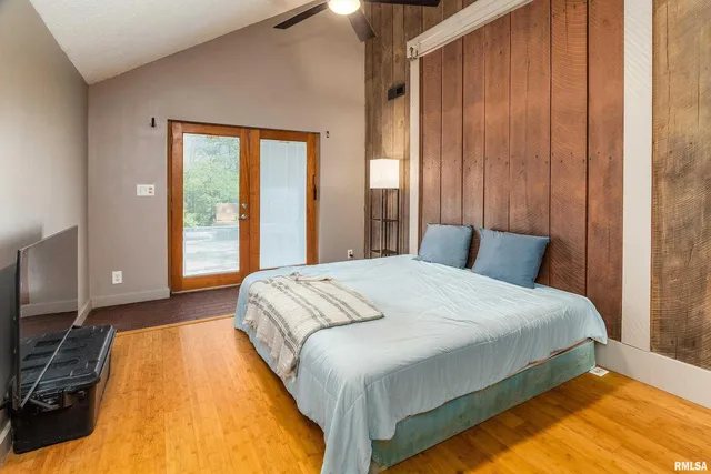 a view of a hallway with wooden floors