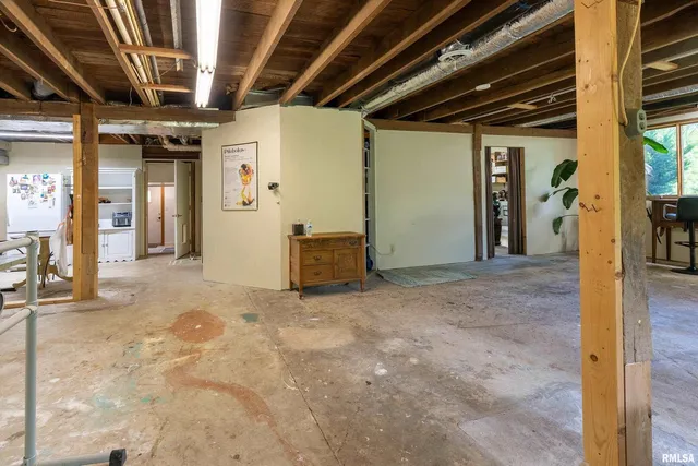 a view of a house with backyard sitting area and garden