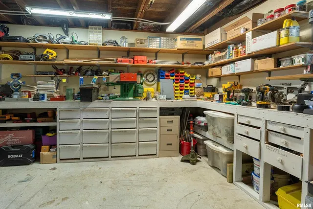 a bedroom with furniture and large windows