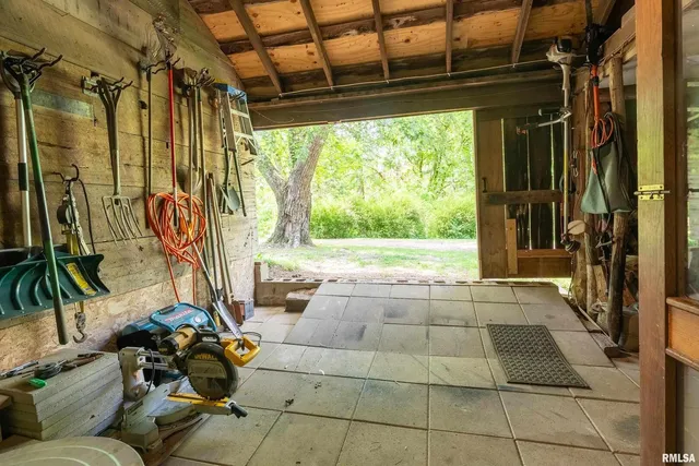 a bed sitting in a bedroom next to a large window