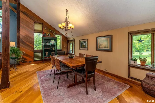 a living room with furniture pool table and a flat screen tv