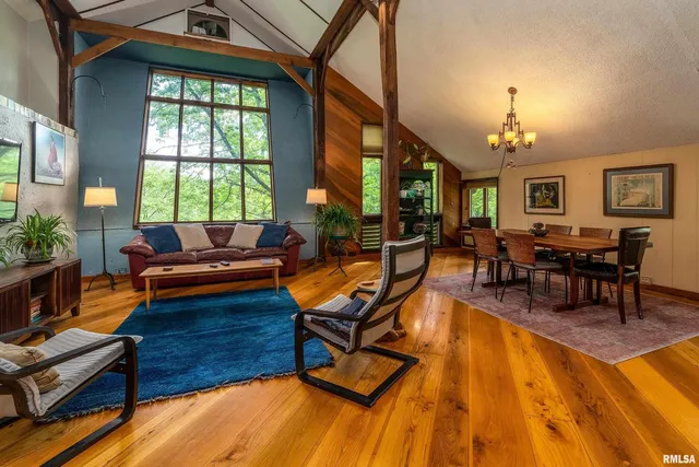 a swimming pool with potted plants and wooden floor