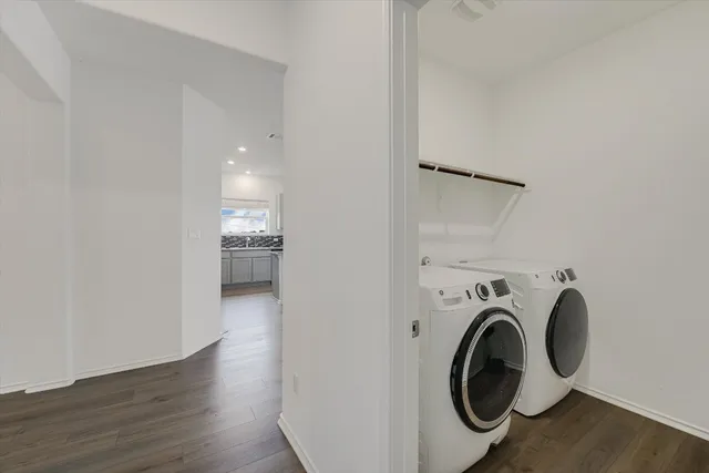 a view of livingroom with washer and dryer