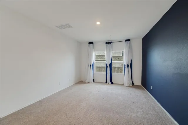 a view of room and refrigerator