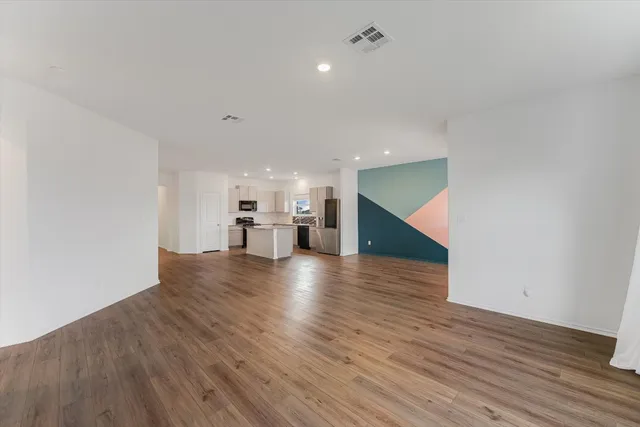 a view of a kitchen with a sink and a window