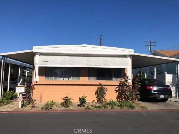 a view of a building with car parked