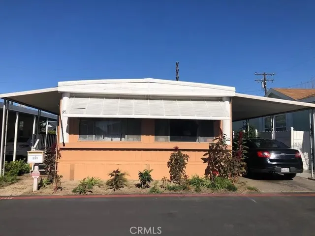 a view of a building with car parked