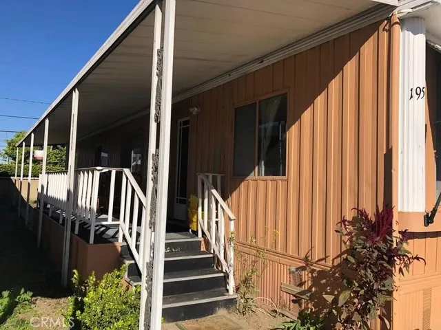 a view of balcony with potted plants