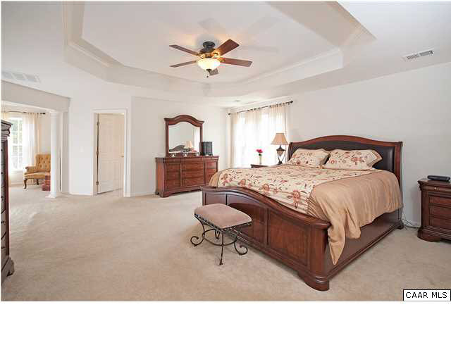 1099 Willow Ridge Road Troy, VA 22974 - Photo 11 of 39 a bedroom with a bed and a chandelier