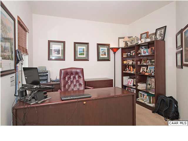 1099 Willow Ridge Road Troy, VA 22974 - Photo 22 of 39 a living room with furniture and a flat screen tv