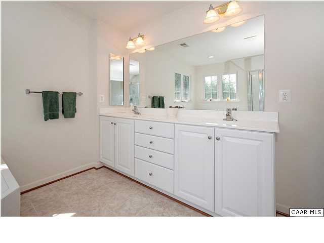 1099 Willow Ridge Road Troy, VA 22974 - Photo 26 of 39 a bathroom with a sink double vanity and a mirror