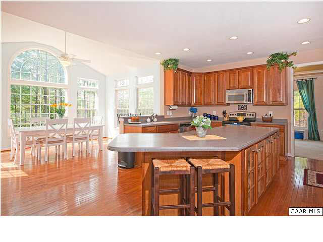 1099 Willow Ridge Road Troy, VA 22974 - Photo 7 of 39 a open kitchen with dining table and a large window