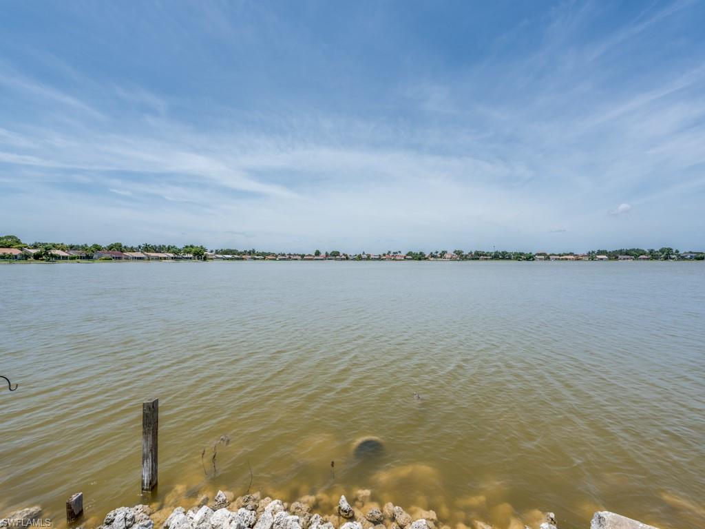 7175 Mill Pond Circle Naples, FL 34109 - Photo 3 of 14 a view of a lake view