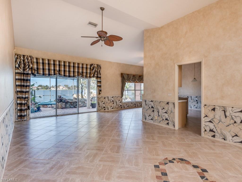 7175 Mill Pond Circle Naples, FL 34109 - Photo 5 of 14 a view of livingroom with hardwood floor and a ceiling fan