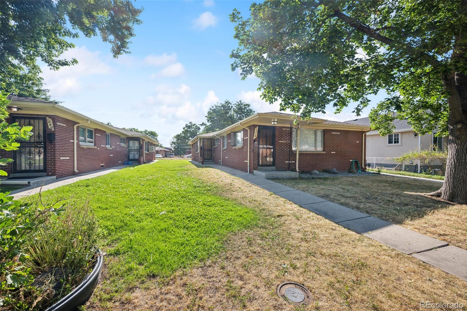 1070 South Decatur Street Denver, CO 80219 - Photo 1 of 18 a view of a house with a backyard