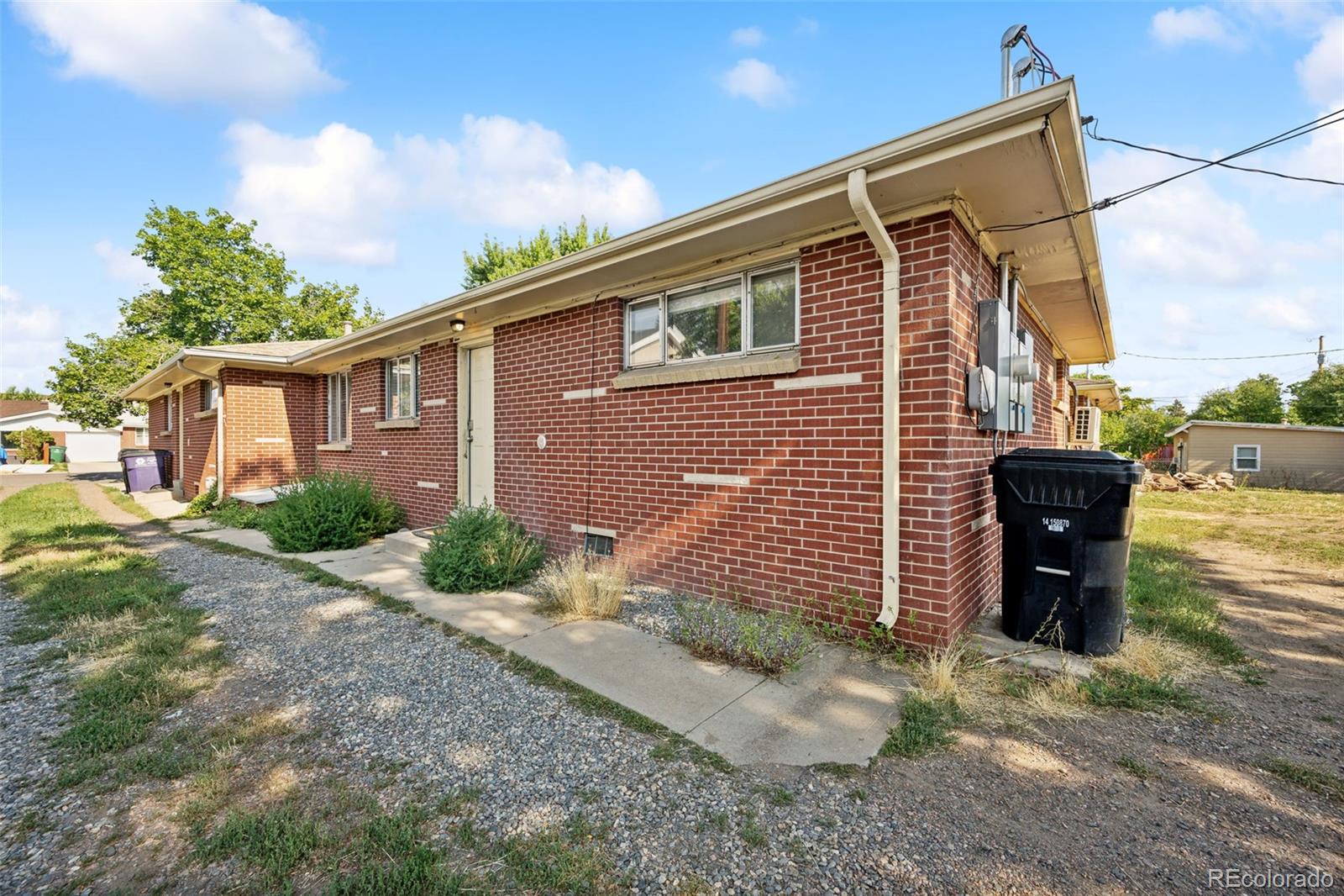 1070 South Decatur Street Denver, CO 80219 - Photo 18 of 18 a backyard of a house with potted plants