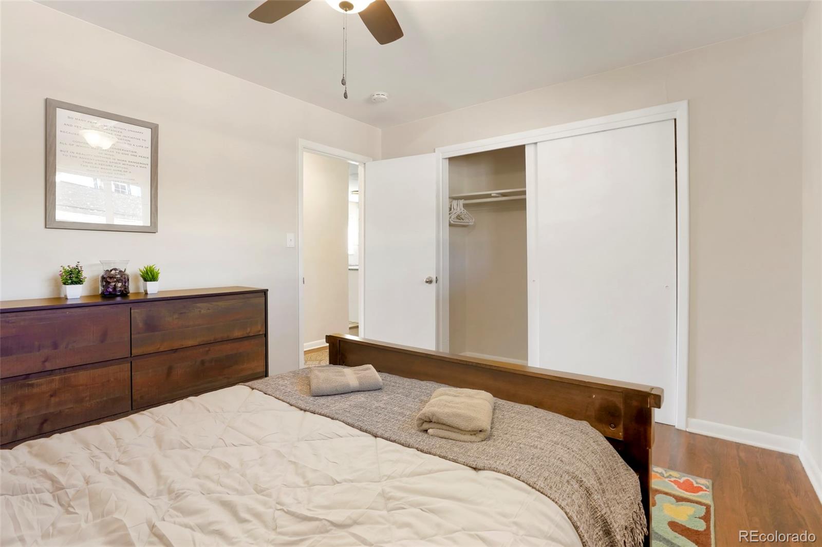 1070 South Decatur Street Denver, CO 80219 - Photo 9 of 18 a bedroom with a bed and a window