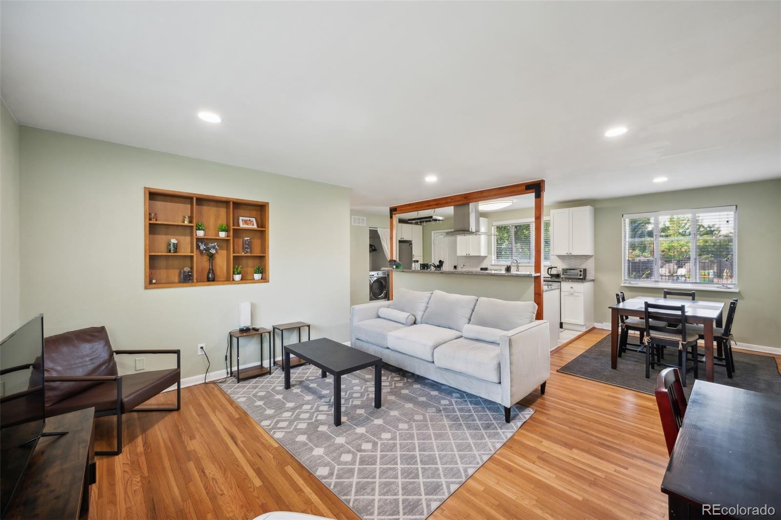 1070 South Decatur Street Denver, CO 80219 - Photo 10 of 18 a living room with furniture and a large window
