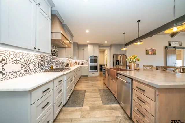 a bedroom with a bed a large window and glass door