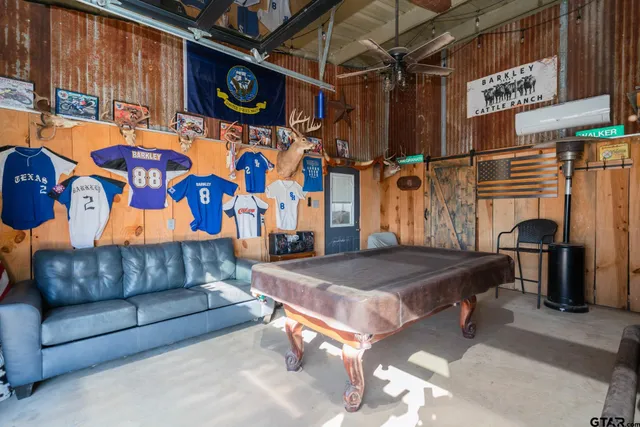 a view of swimming pool with an outdoor seating