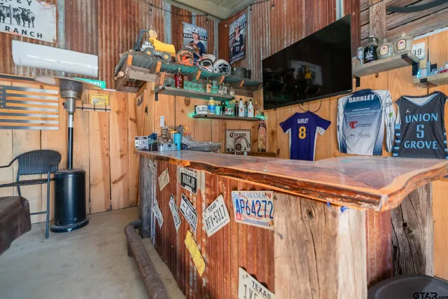 a front view of house with yard and outdoor seating