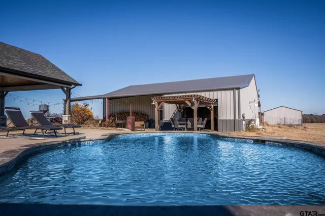 a living room with furniture fireplace and a window