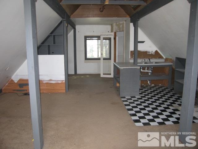 2354 Cartwright Road Reno, NV 89521 - Photo 11 of 15 a living room with a black white checkered floor with a white walls
