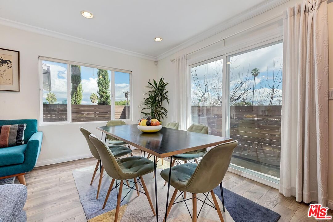 3838 Crestview Road Culver City, CA 90232 - Photo 13 of 53 a view of a dining room with furniture window and wooden floor