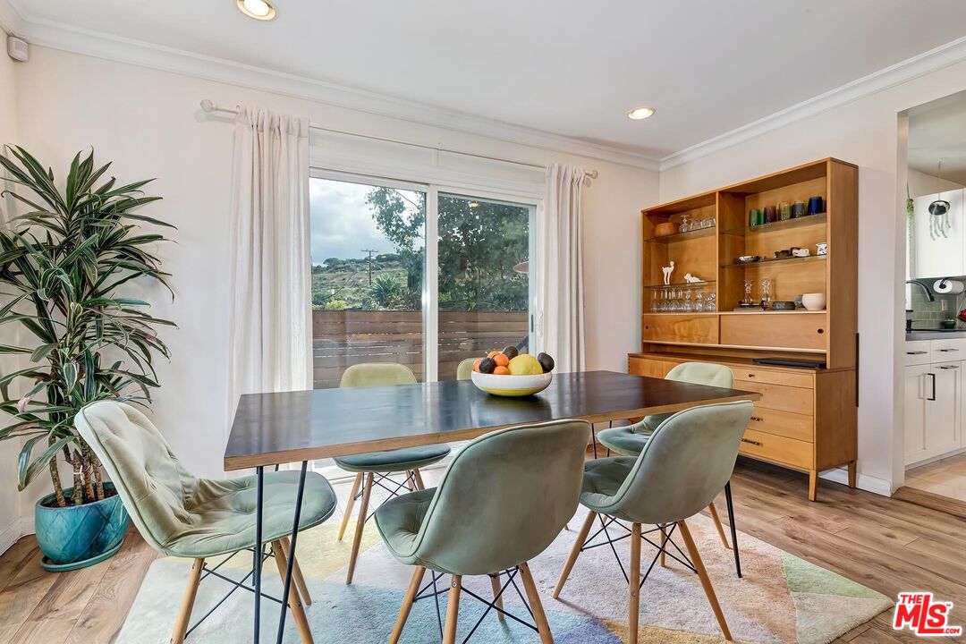 3838 Crestview Road Culver City, CA 90232 - Photo 14 of 53 a view of a dining room with furniture window and outside view