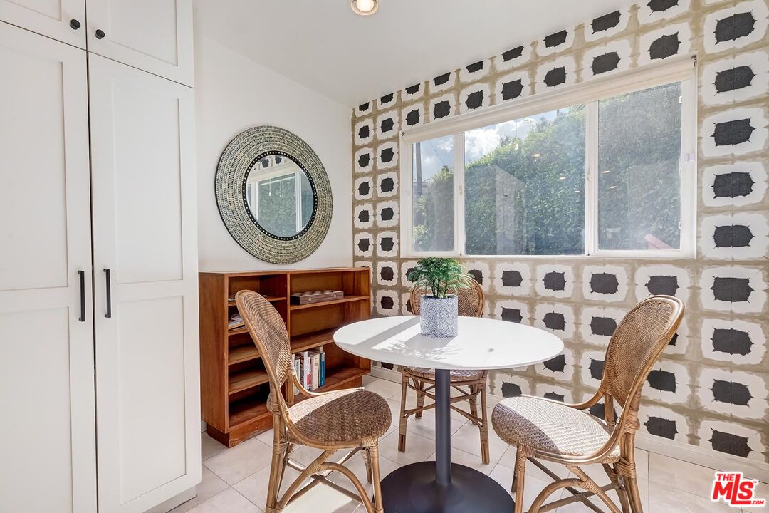 3838 Crestview Road Culver City, CA 90232 - Photo 18 of 53 a view of a dining room with furniture and chandelier
