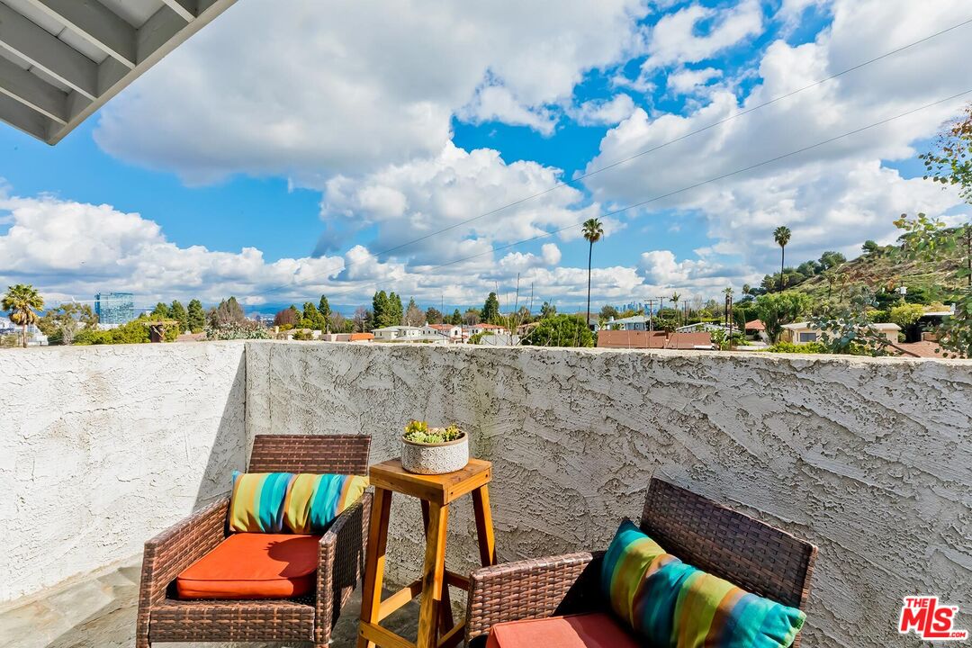 3838 Crestview Road Culver City, CA 90232 - Photo 23 of 53 a view of a terrace with furniture and city view