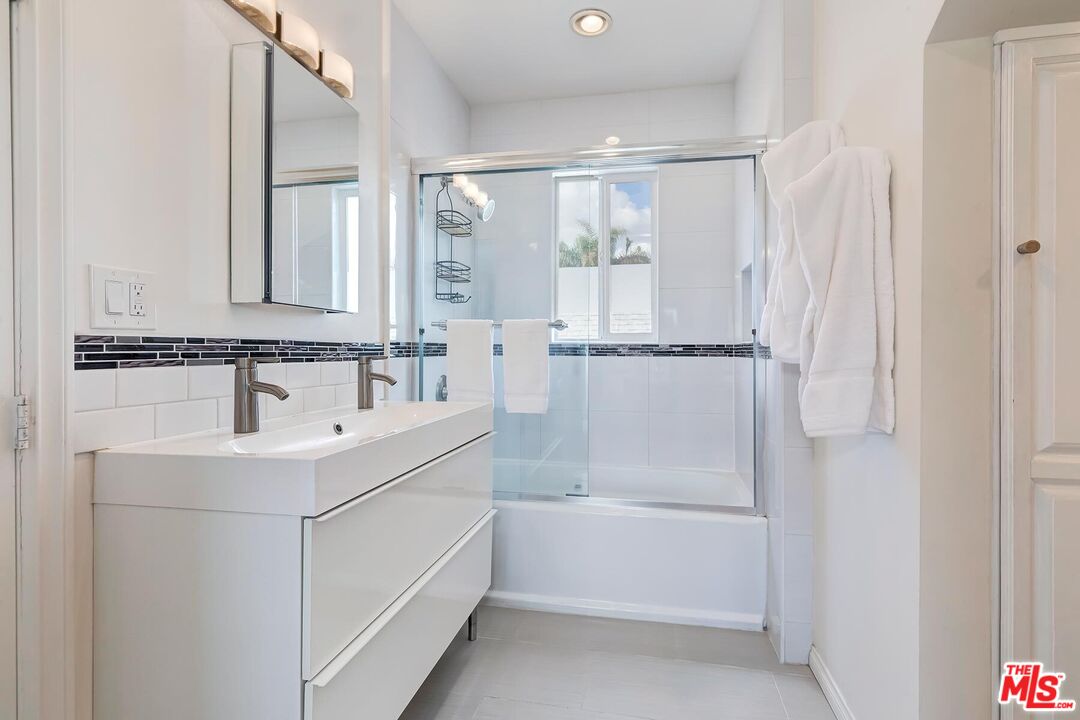 3838 Crestview Road Culver City, CA 90232 - Photo 30 of 53 a white bath tub sitting next to a white sink