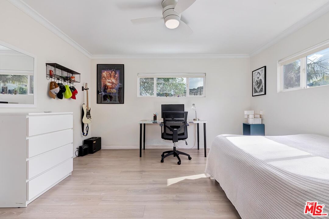 3838 Crestview Road Culver City, CA 90232 - Photo 32 of 53 a view of a workspace with lounge chair and a window