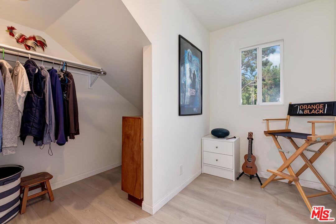 3838 Crestview Road Culver City, CA 90232 - Photo 33 of 53 a view of walk in closet with clothes and shoes