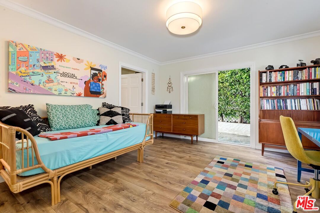 3838 Crestview Road Culver City, CA 90232 - Photo 35 of 53 a bedroom with furniture and a book shelf