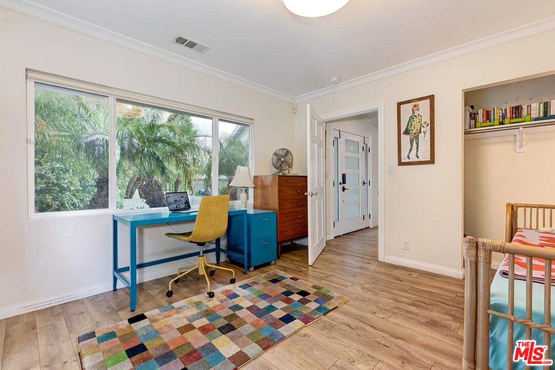 3838 Crestview Road Culver City, CA 90232 - Photo 36 of 53 a living room with furniture and a rug